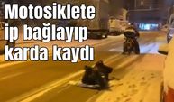 Motosiklete ip bağlayıp karda kaydı