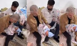Sosyal medyada tepki çeken görüntüler! Yenidoğan bebeği paraya sardılar