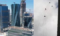 Gökdelenin camlarını temizlerken kuvvetli rüzgarla savruldular