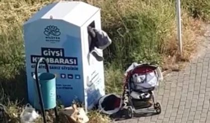 Canlarını hiçe sayarak giysi kumbarasından kıyafet çaldılar