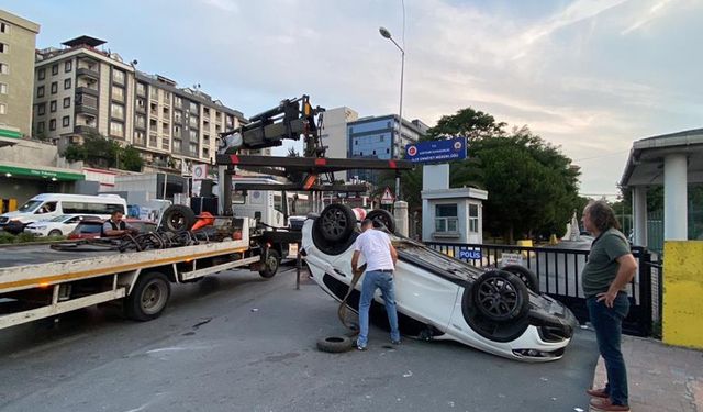 Takla atan otomobil emniyetin önüne uçtu